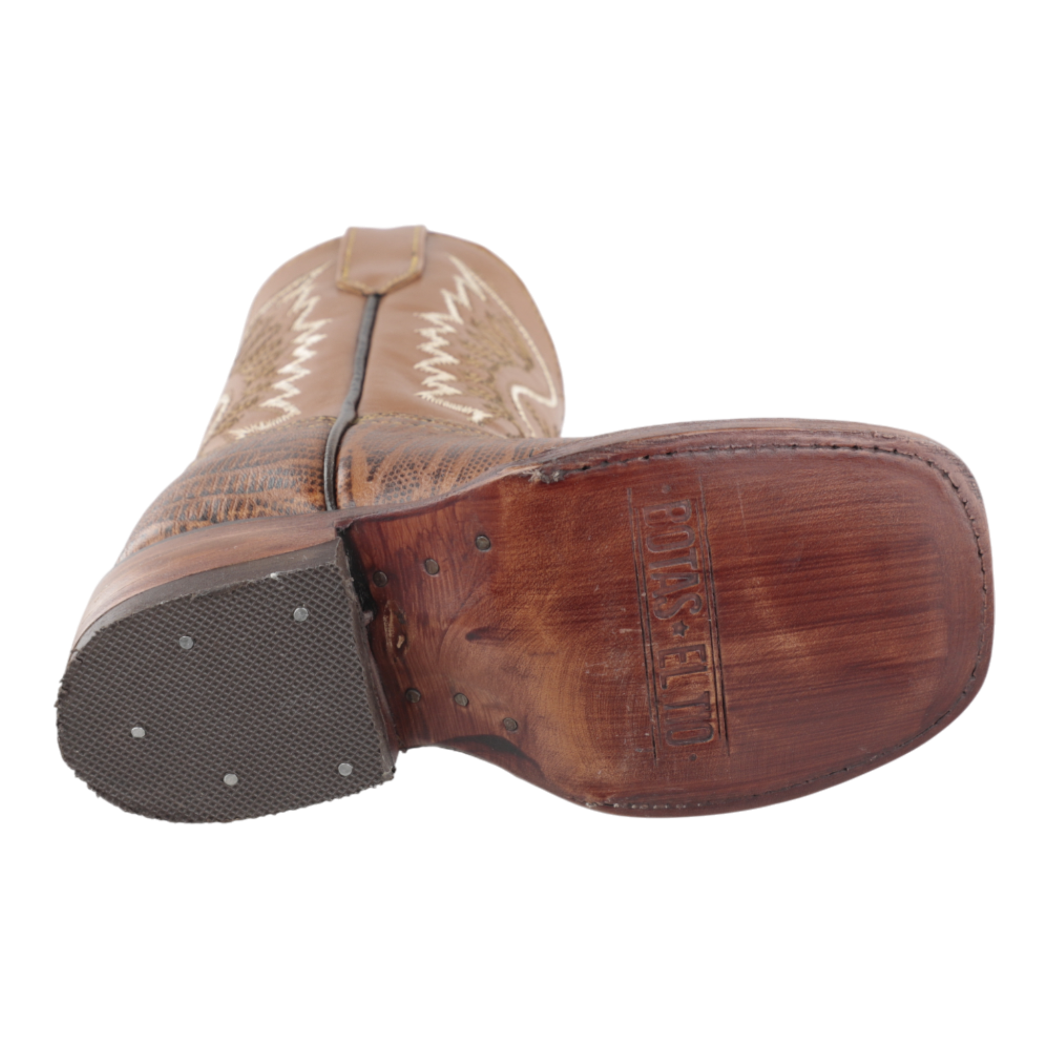 Vista del tacón y suela vaquera Bulldog en botas de niño color miel